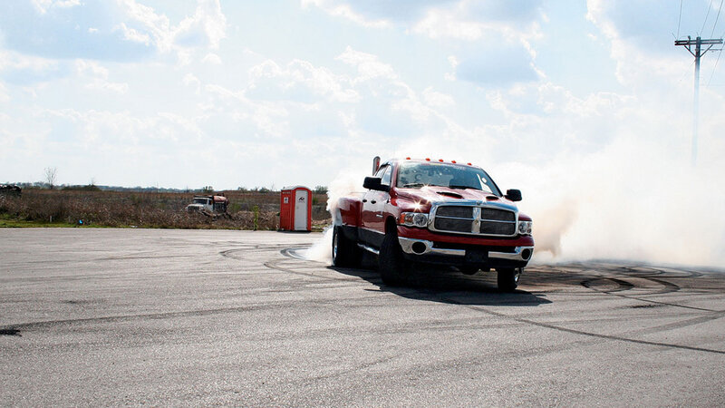 Red pickup truck drifting