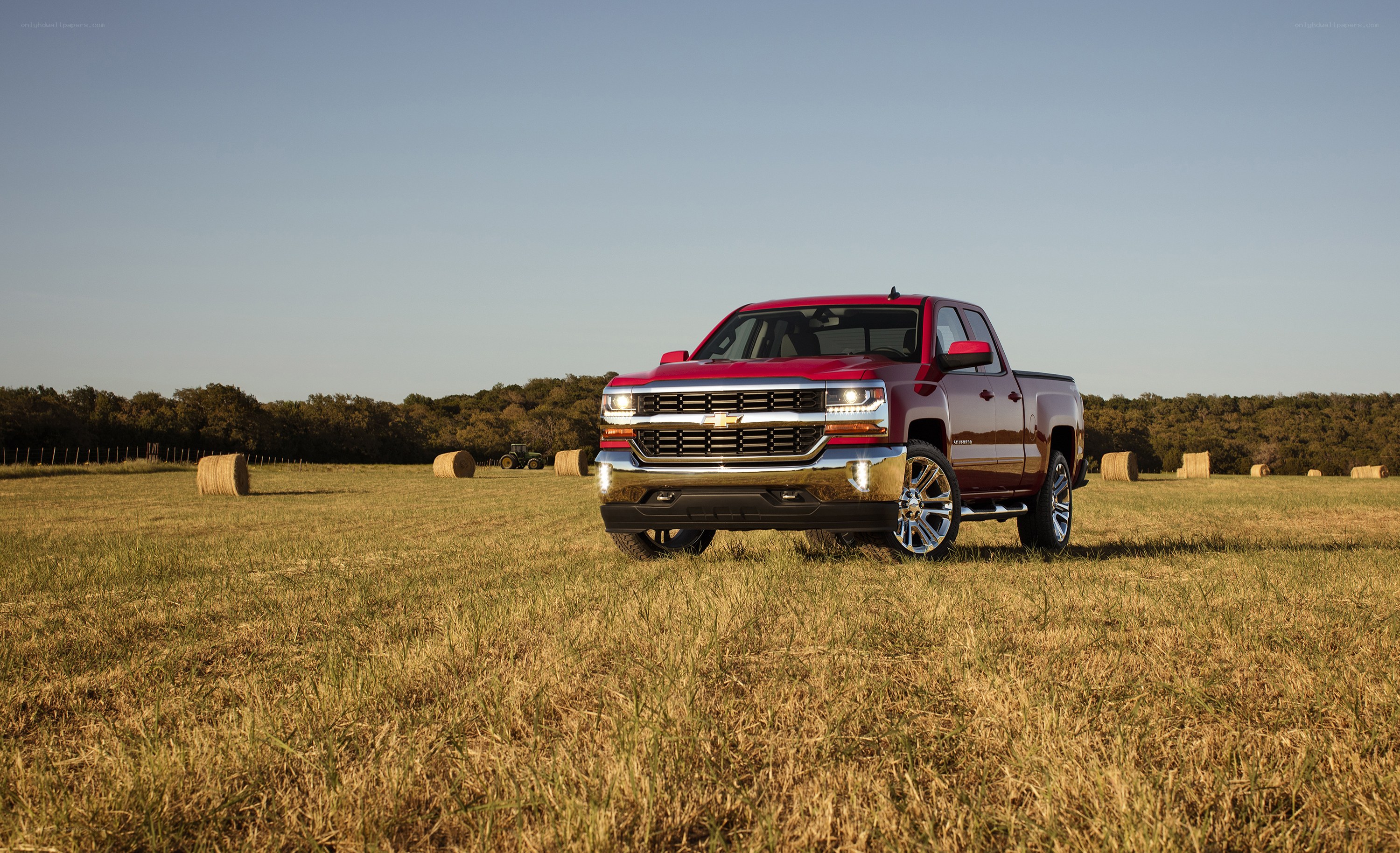 Red pickup truck in field