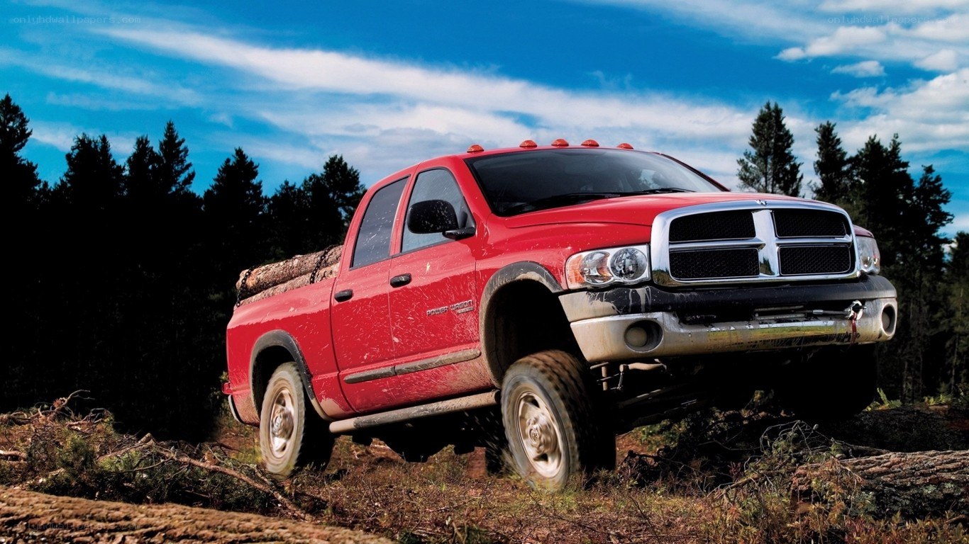 Red pickup truck in forest