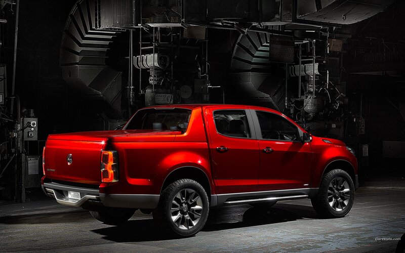 Red pickup truck in industrial setting