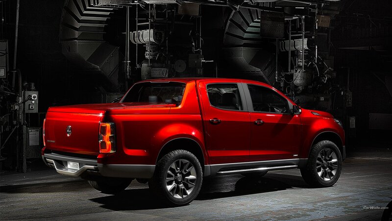 Red pickup truck in industrial setting