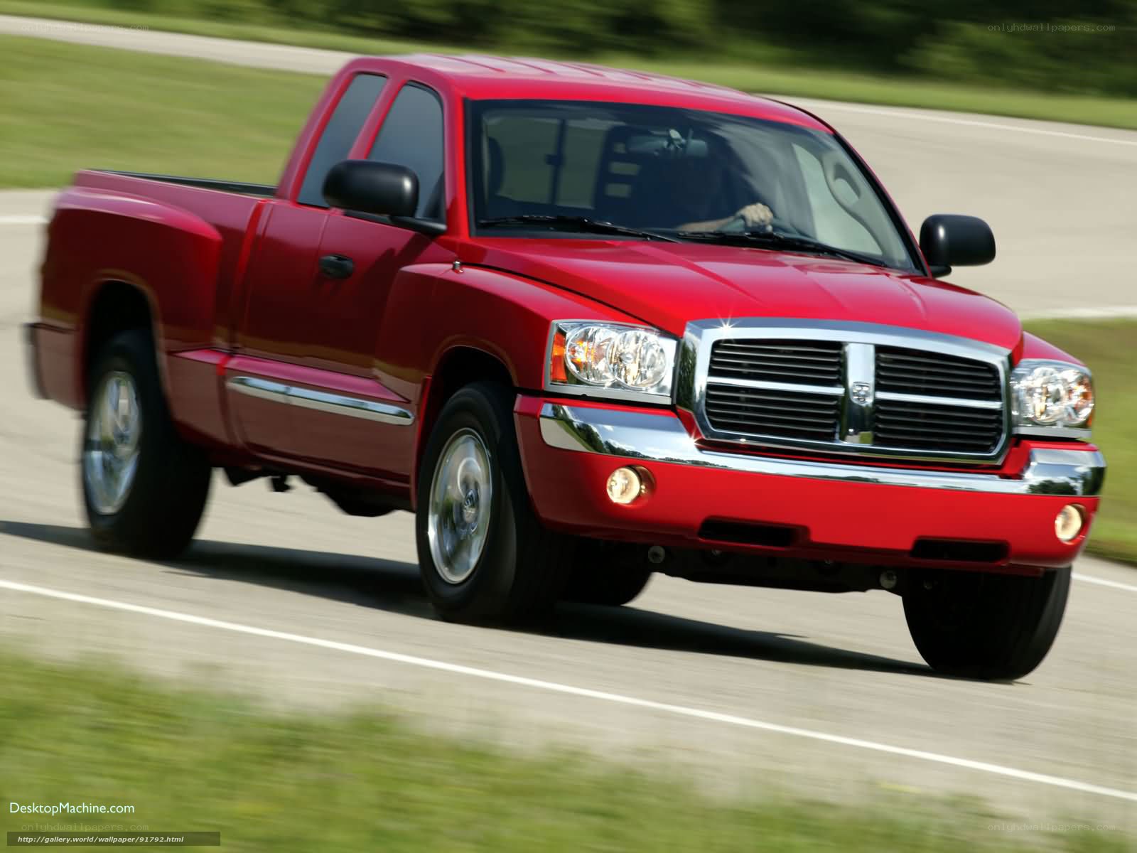 red pickup truck in motion