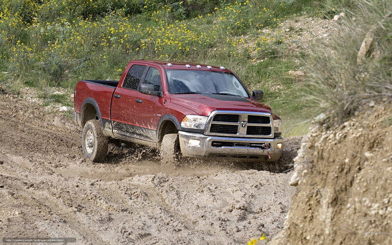 Red pickup truck in mud