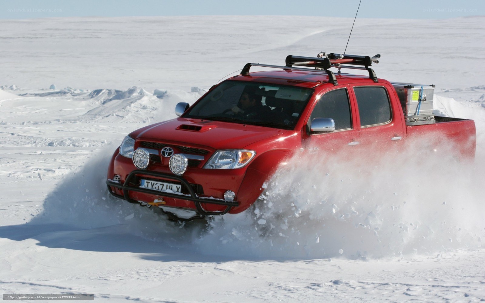Red pickup truck in snow
