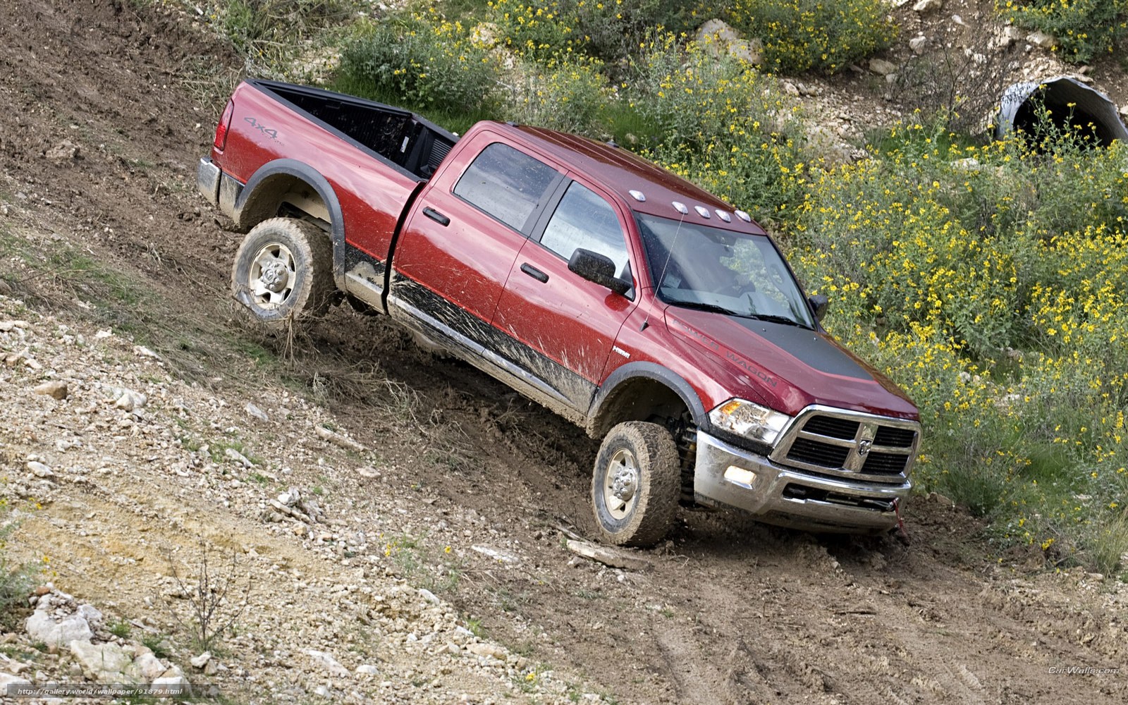 red pickup truck off-roading