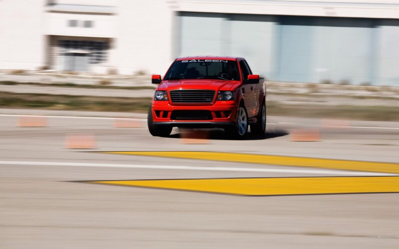 Red pickup truck on a track