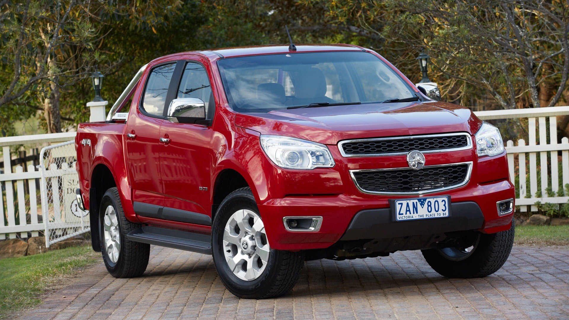 Red pickup truck on driveway