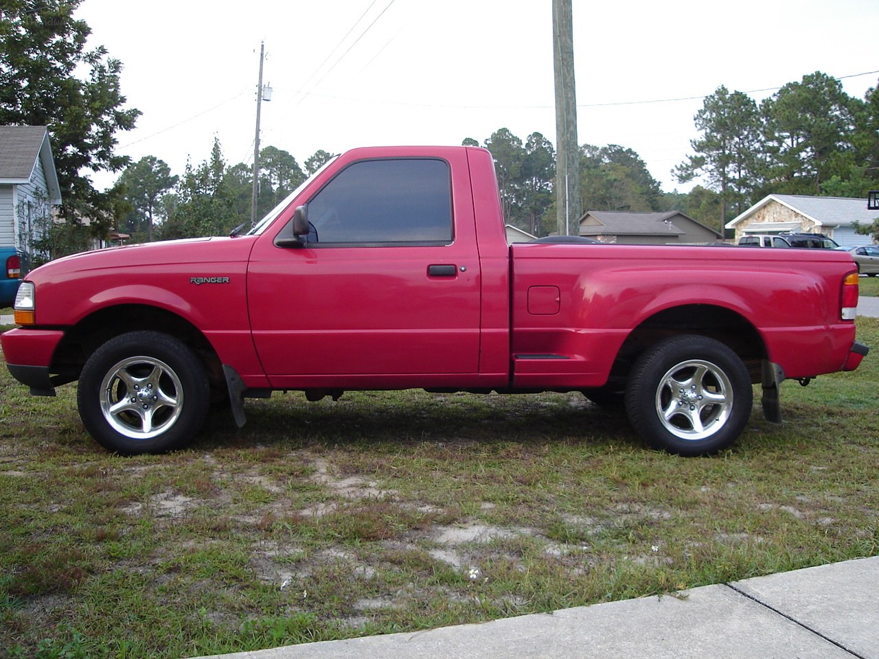 red pickup truck on grass