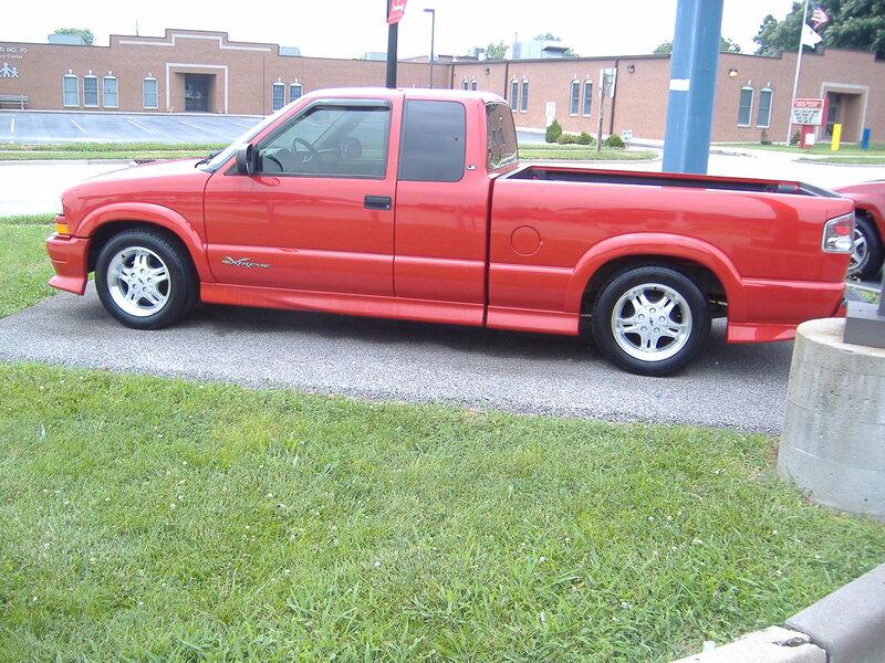 red pickup truck parked outside