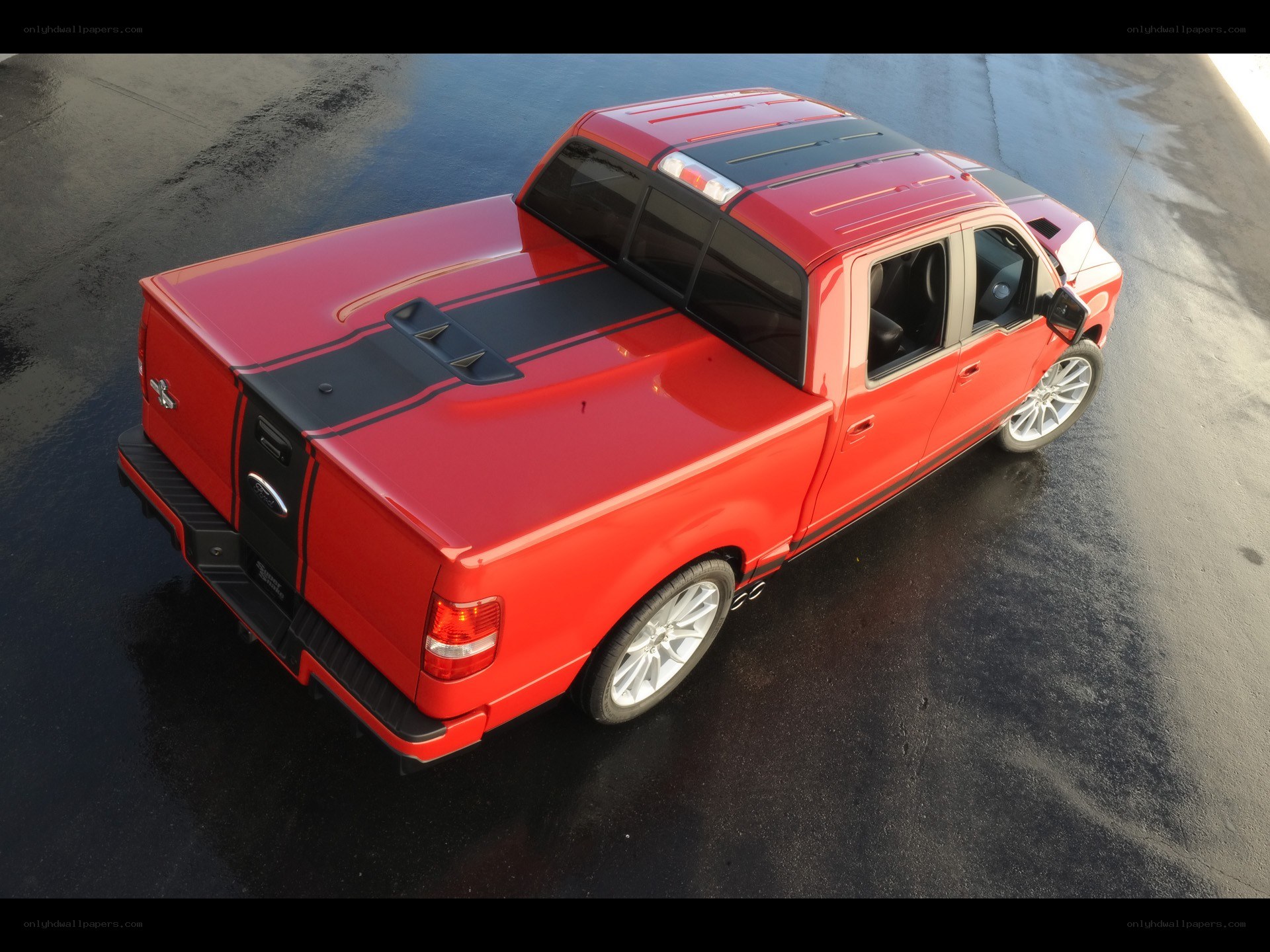 red pickup truck with custom bed cover