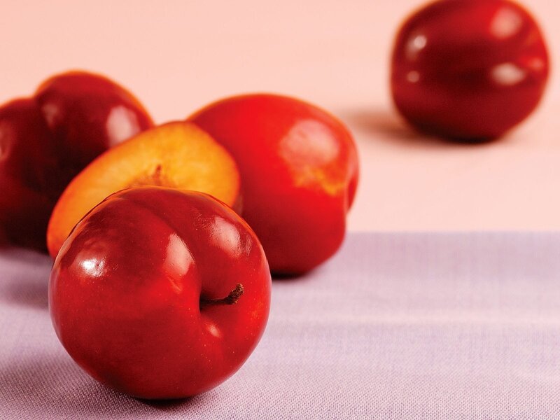 Red plums on a table