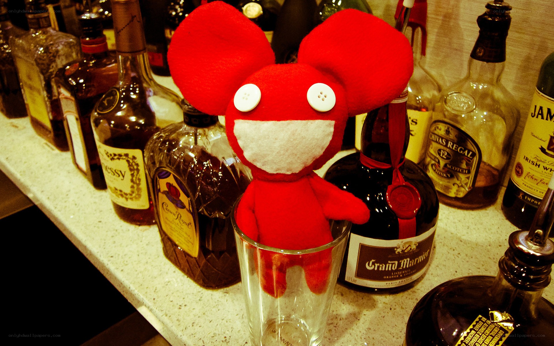 Red plush toy on bar