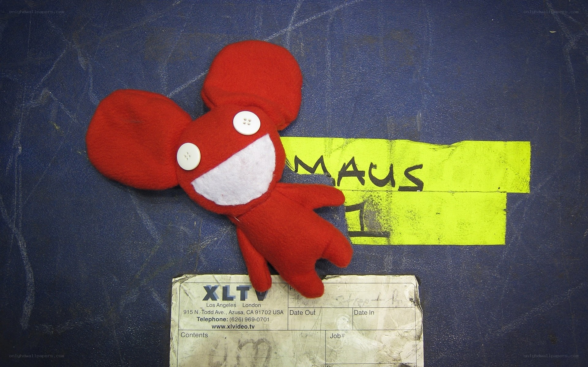 Red plush toy on blue surface