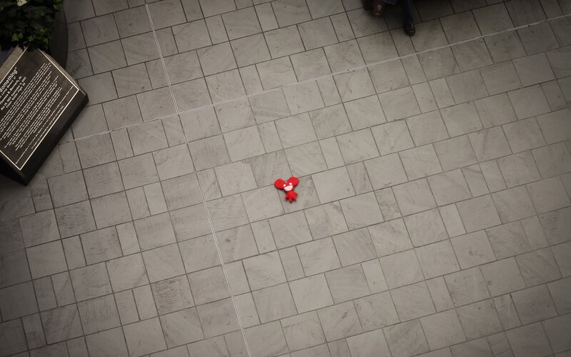 Red plush toy on tiled floor