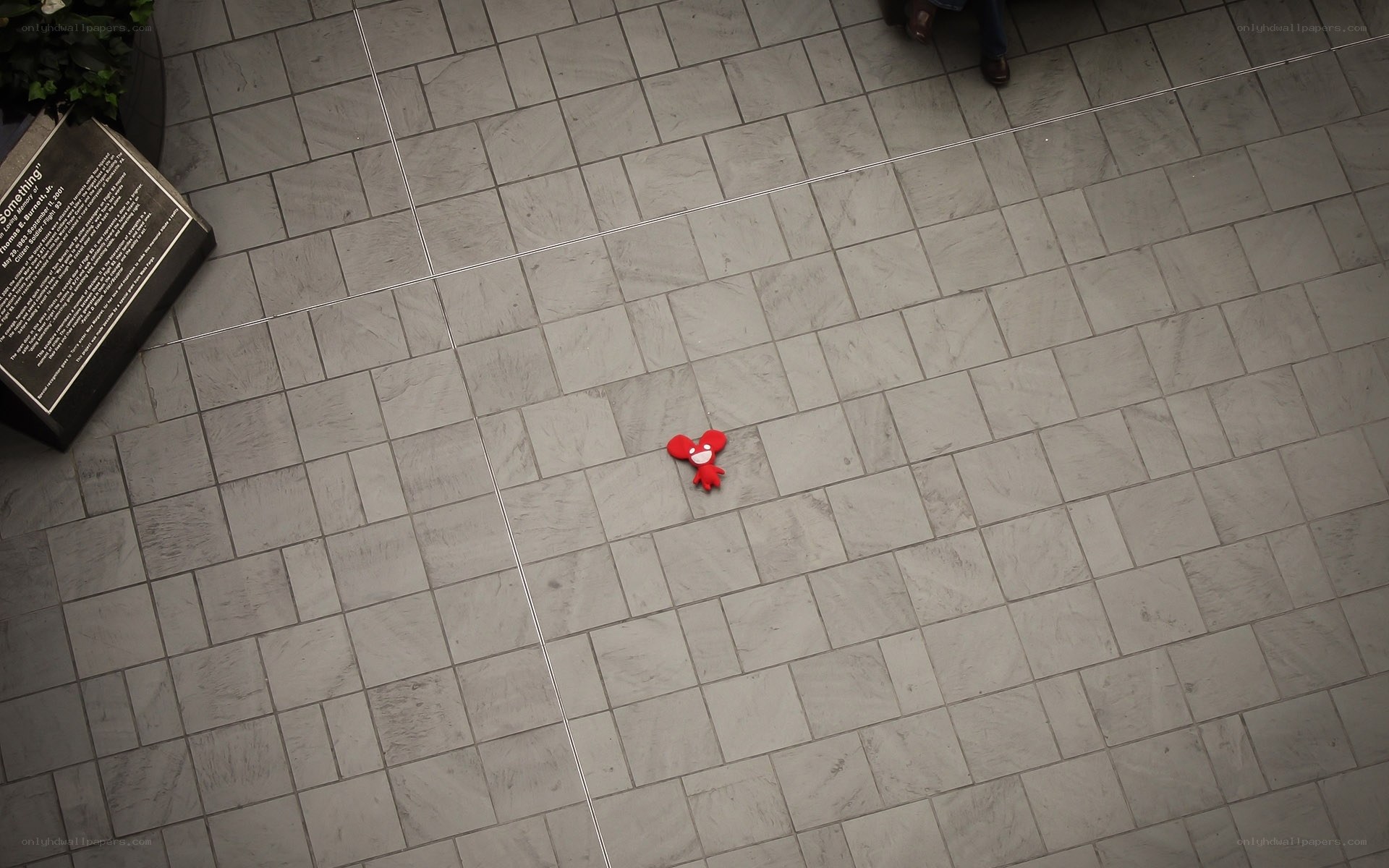 Red plush toy on tiled floor