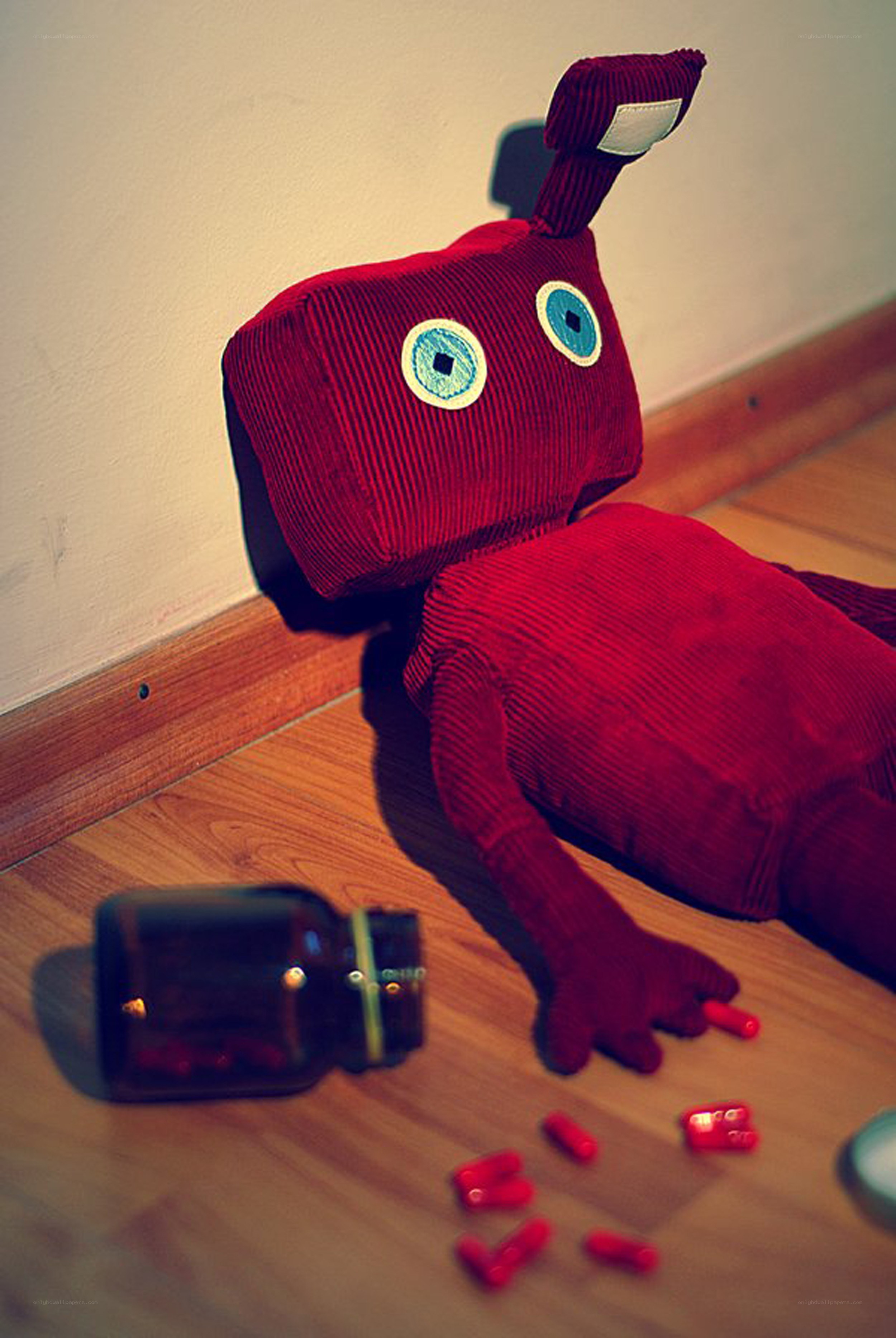 Red plush toy with pills