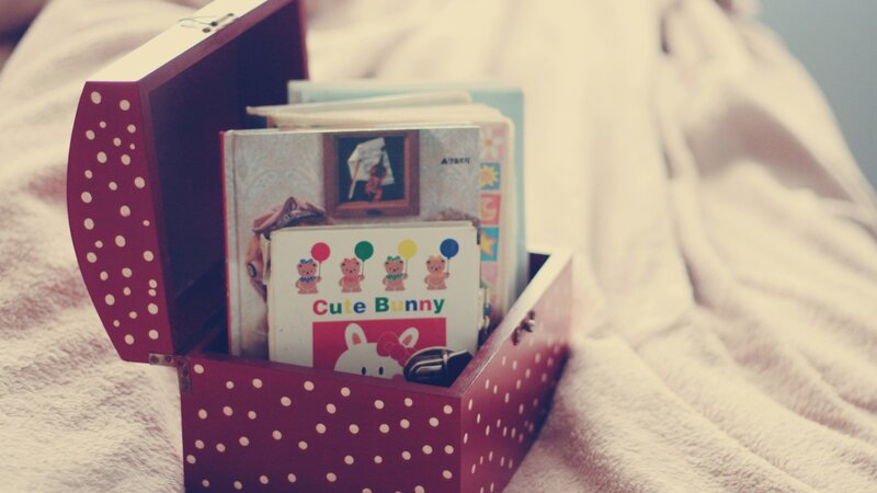 Red polka-dot toy box with books