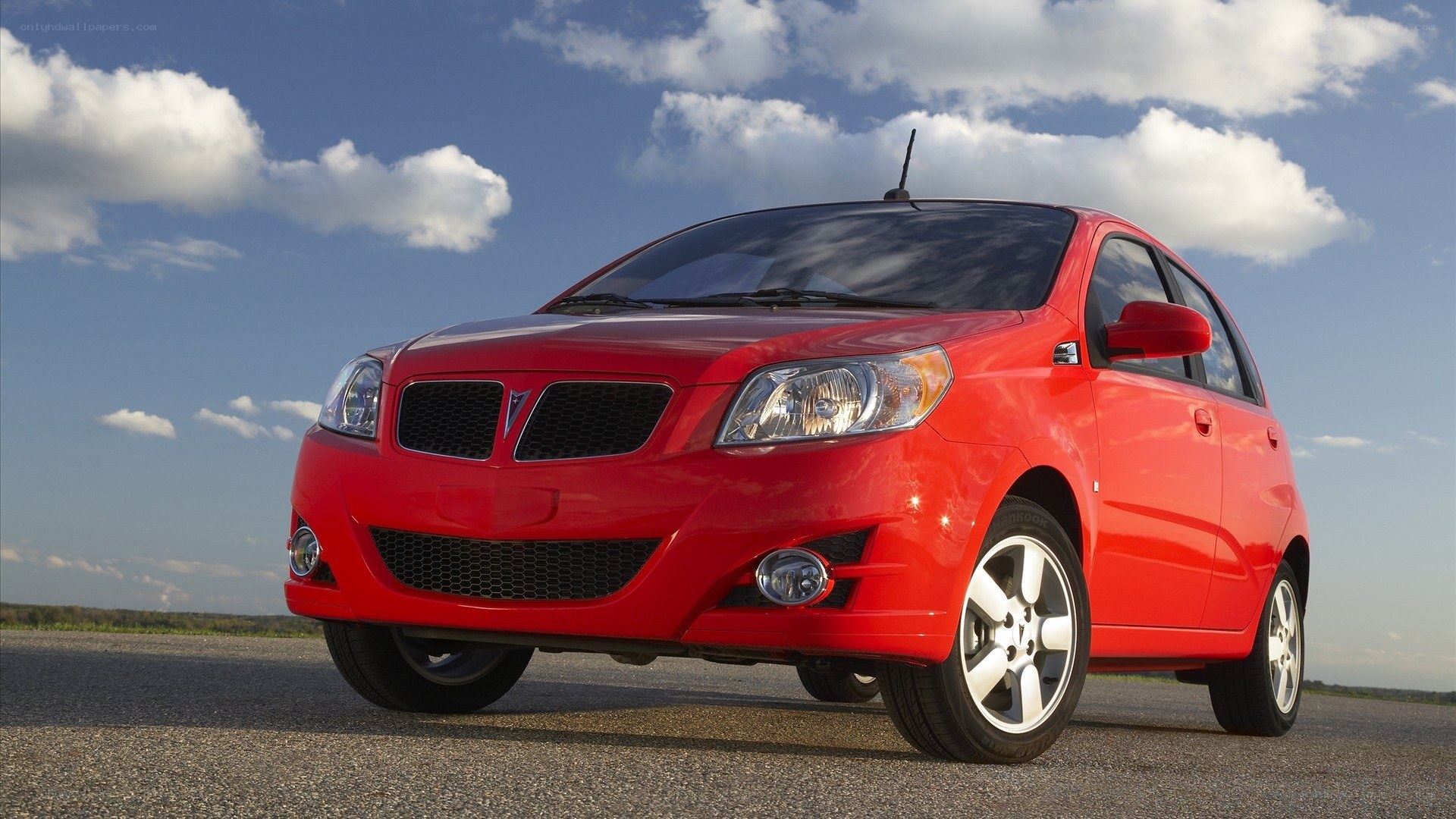 Red Pontiac G3 hatchback