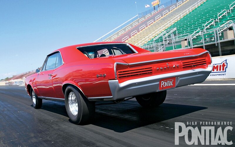 Red Pontiac GTO on a drag strip