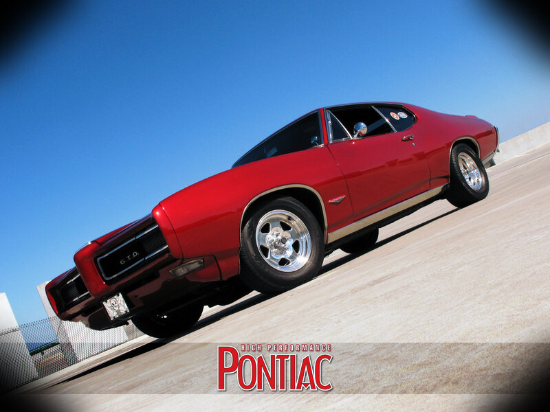 Red Pontiac GTO on a ramp