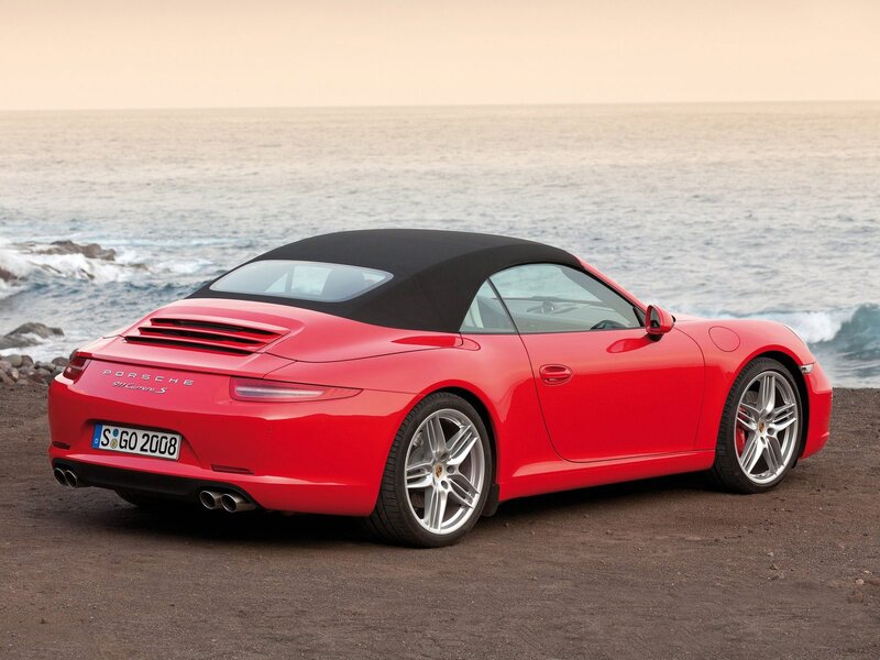 Red Porsche 911 Cabriolet by the sea