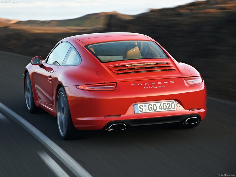 Red Porsche 911 Carrera in motion