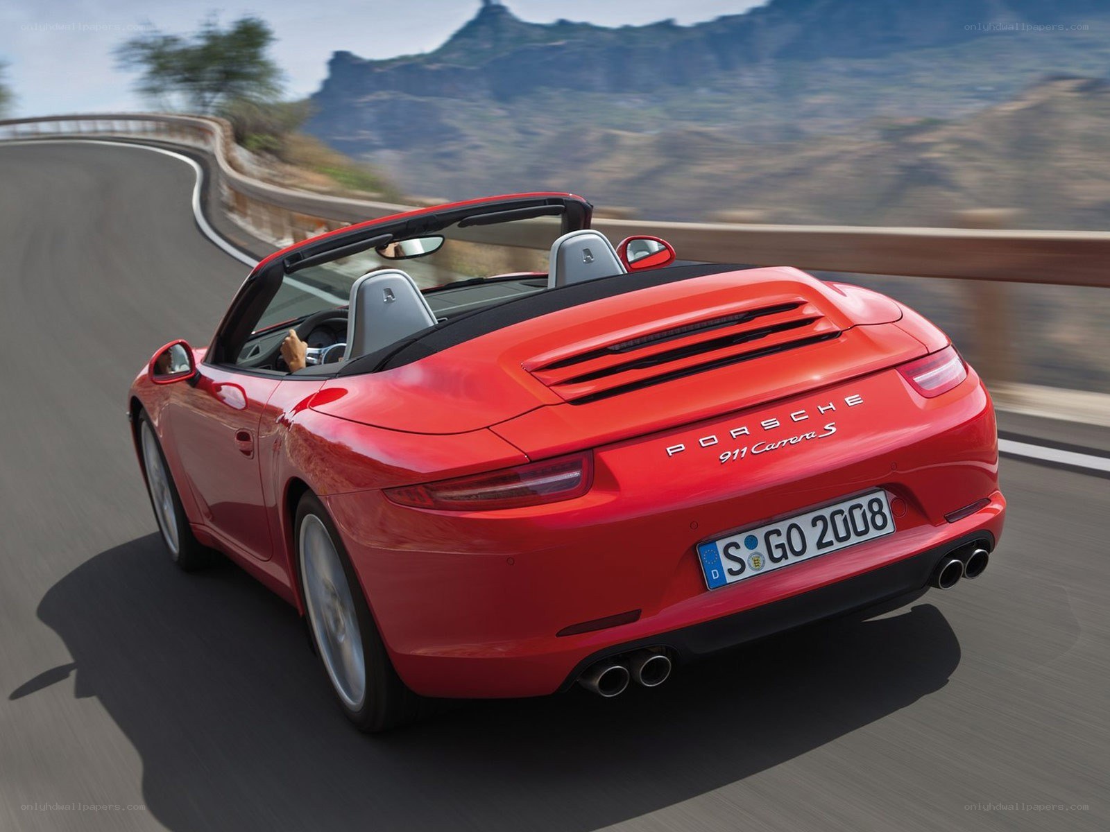 Red Porsche 911 Carrera S driving