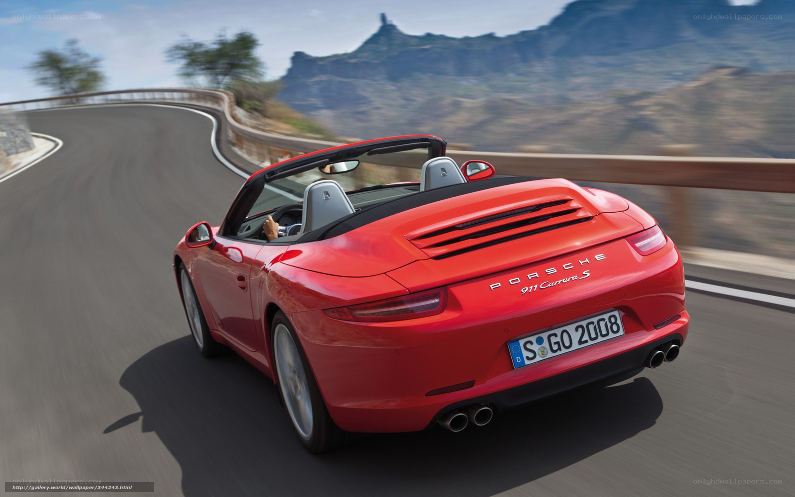 Red Porsche 911 Carrera S driving