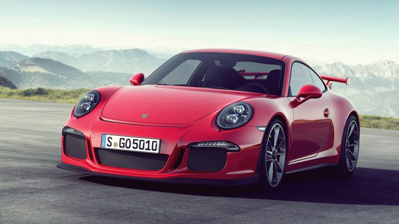 Red Porsche 911 GT3 on mountain road