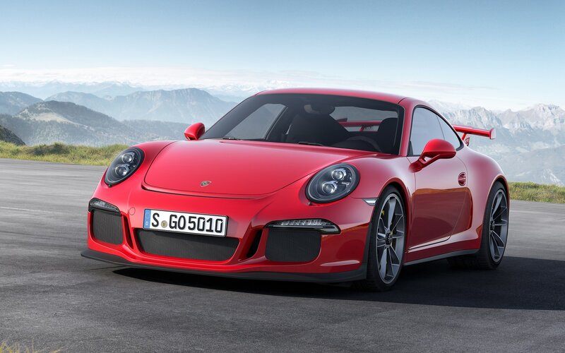 Red Porsche 911 GT3 on mountain road