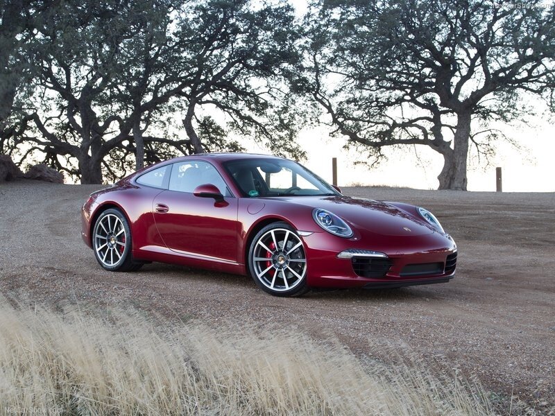 Red Porsche 911 on a dirt road