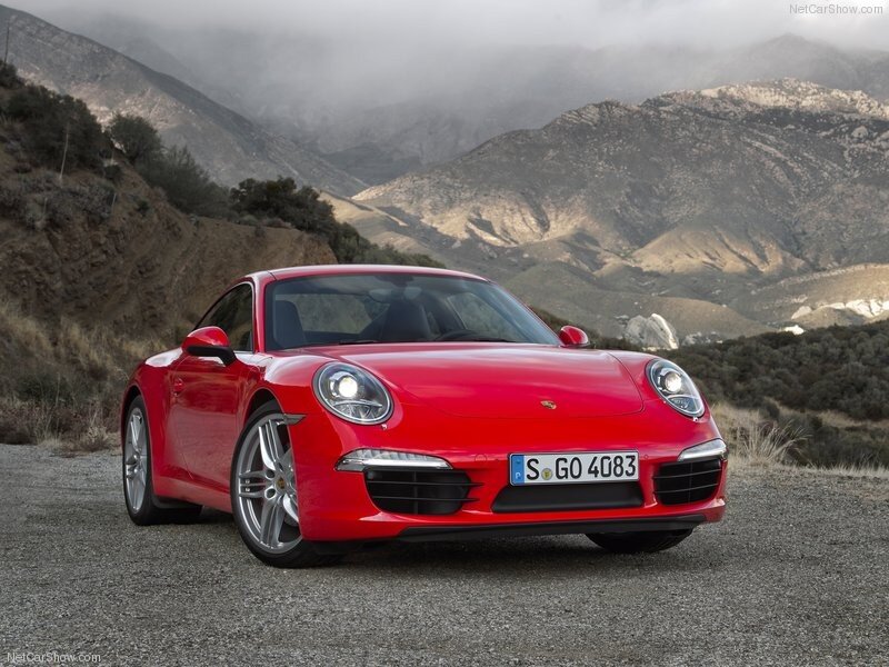 Red Porsche 911 on mountain road
