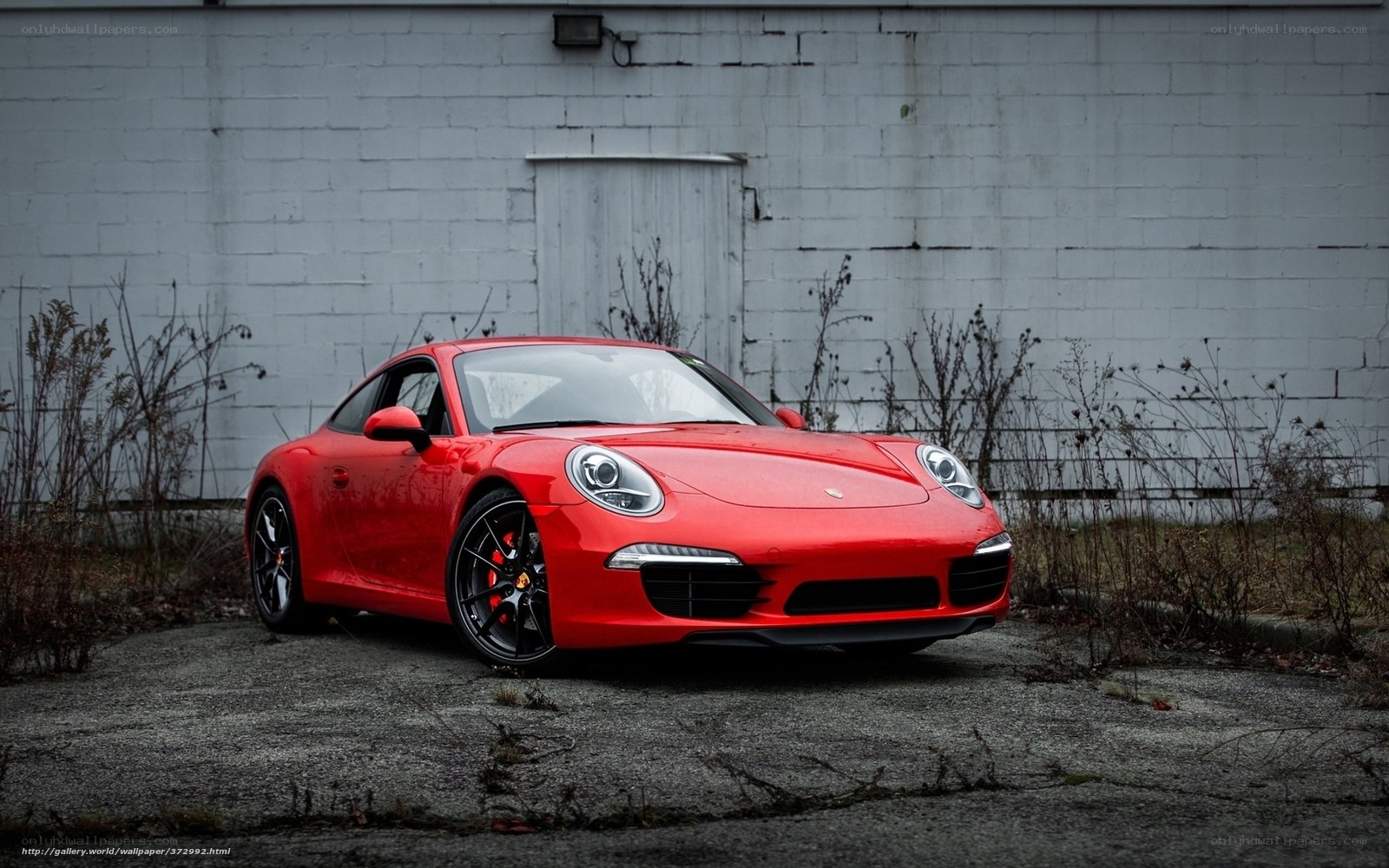 Red Porsche 911 parked outside