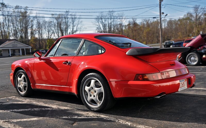 Red Porsche 964 in parking lot