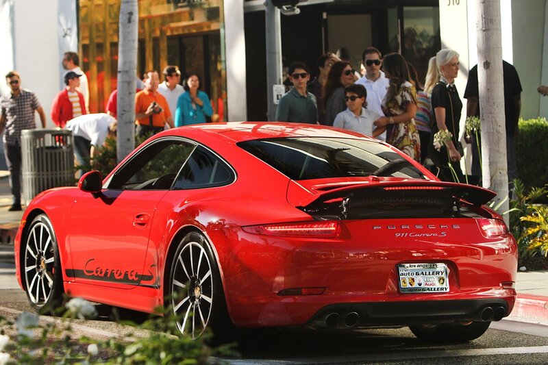 Red Porsche Carrera S on city street