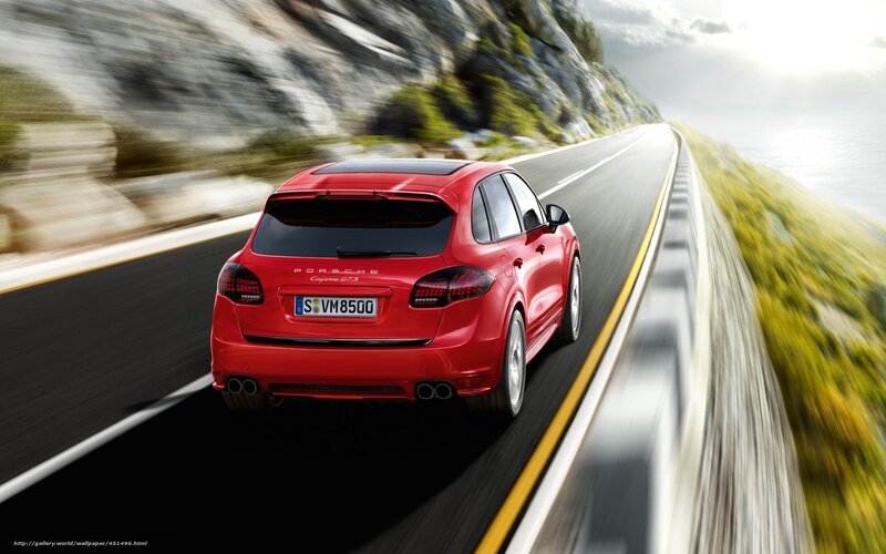 Red Porsche Cayenne GT S on coastal road