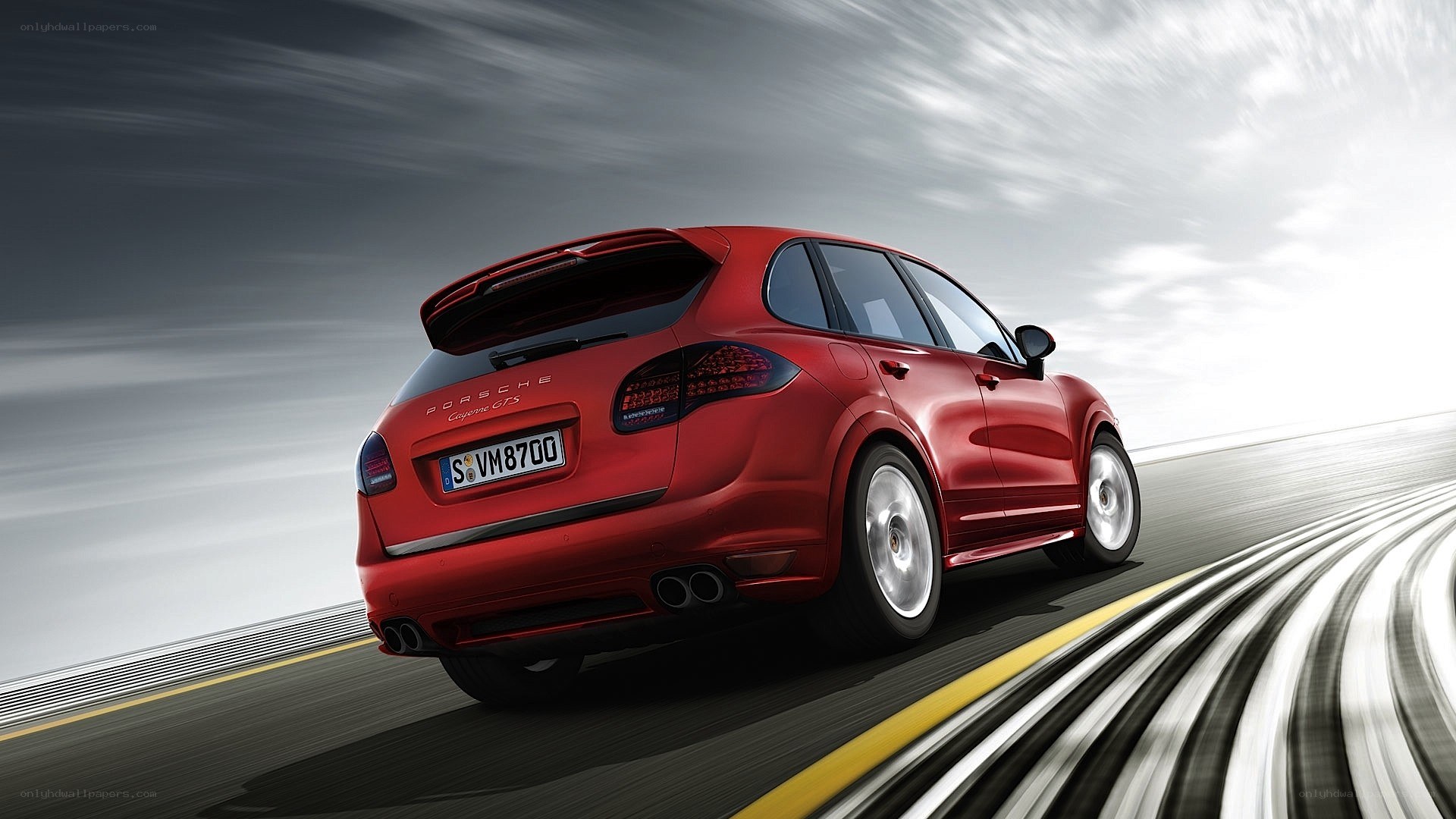 Red Porsche Cayenne GTS in motion