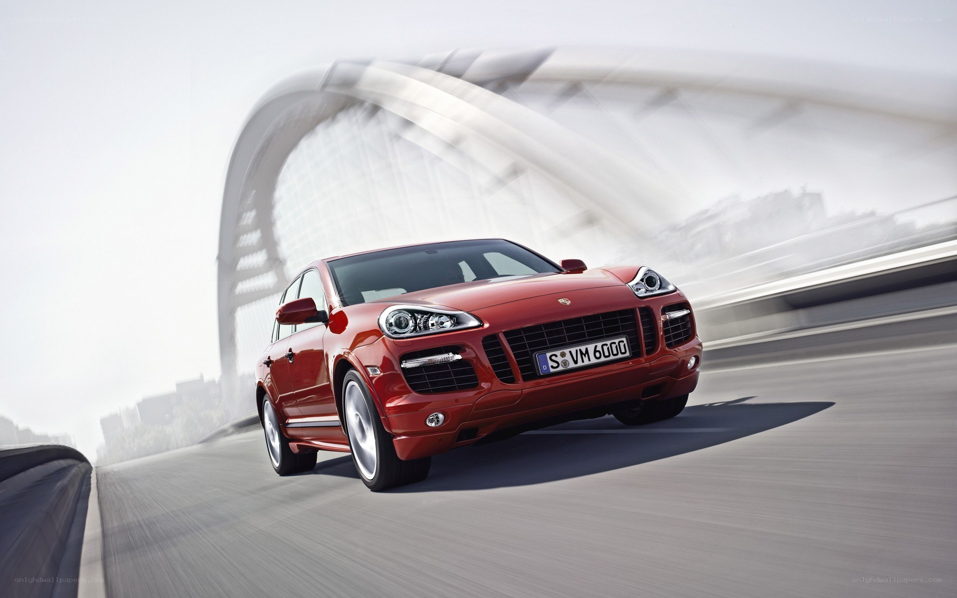 Red Porsche Cayenne in motion