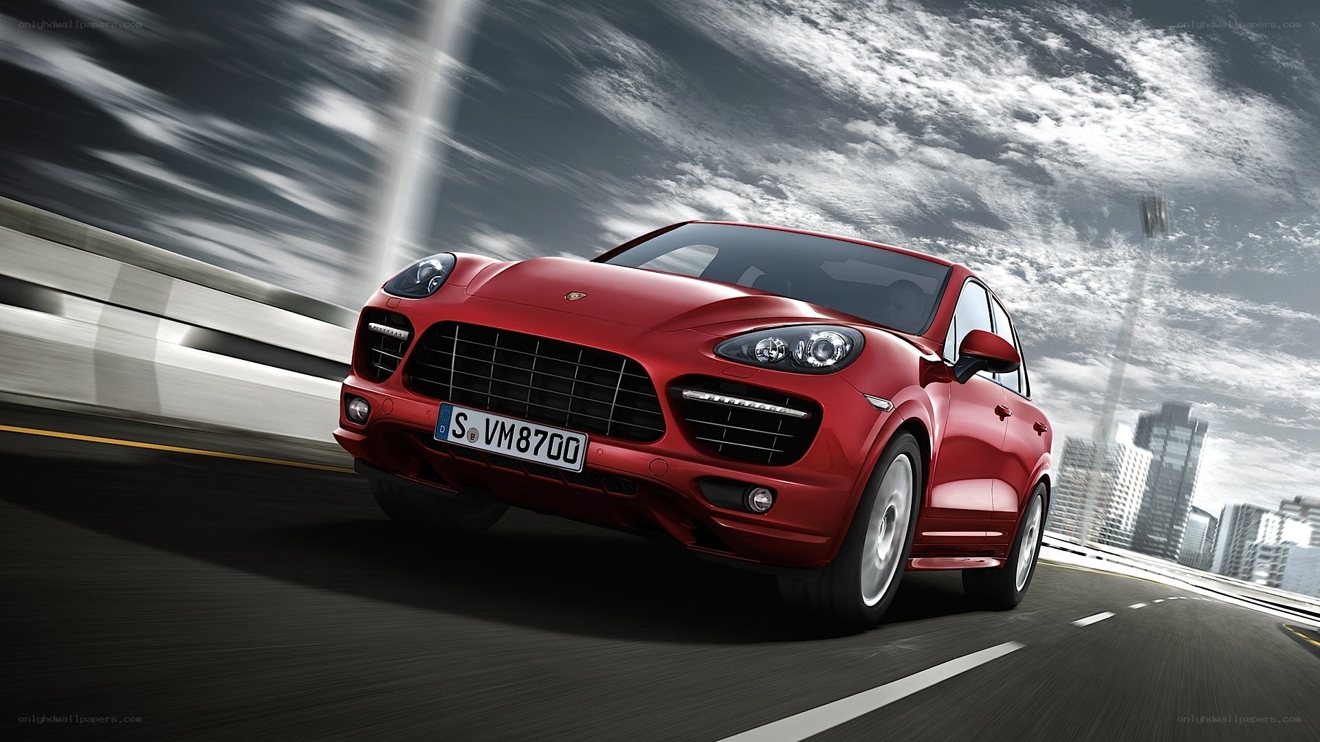 Red Porsche Cayenne in motion
