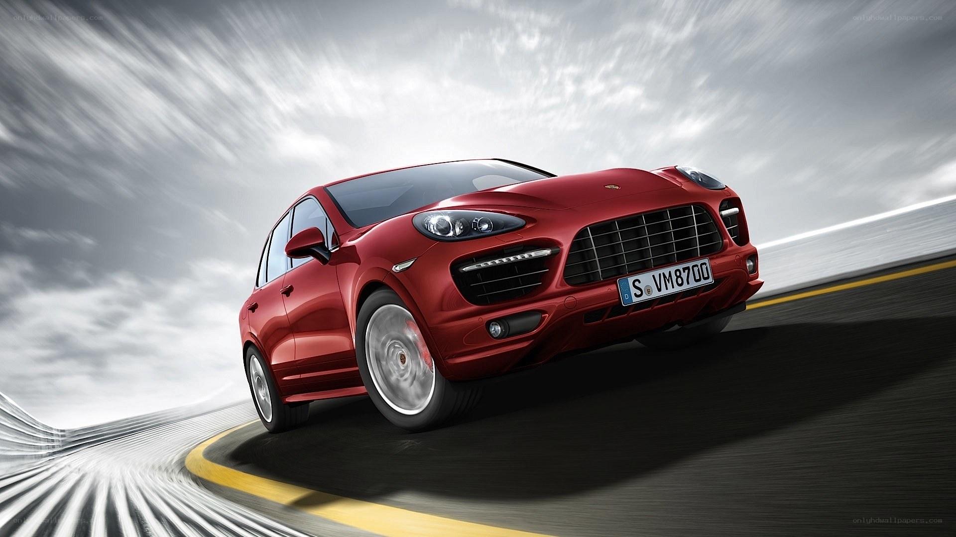 Red Porsche Cayenne in motion