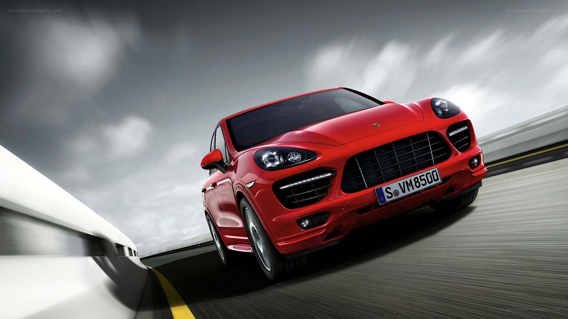 red porsche cayenne in motion