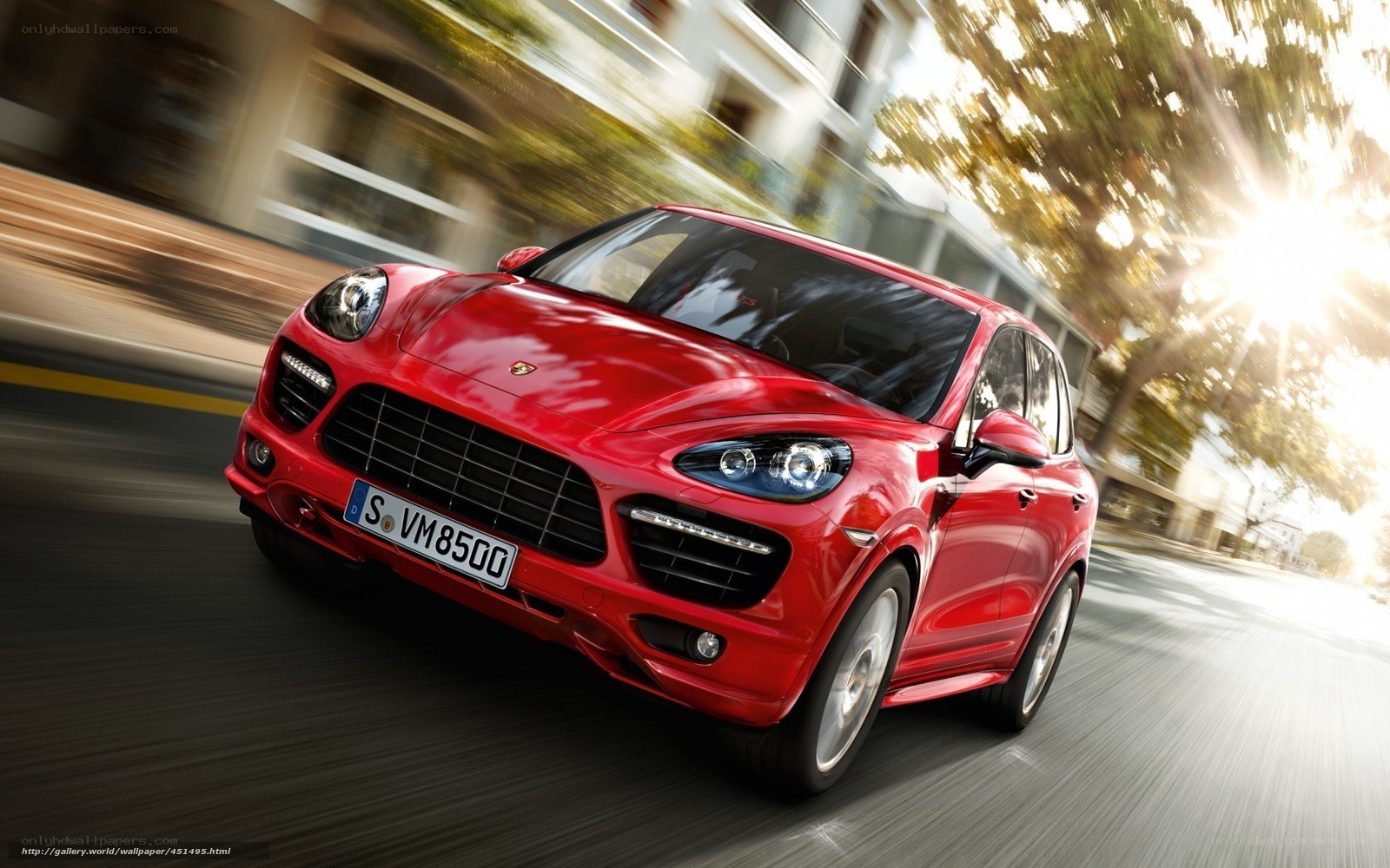 Red Porsche Cayenne in motion