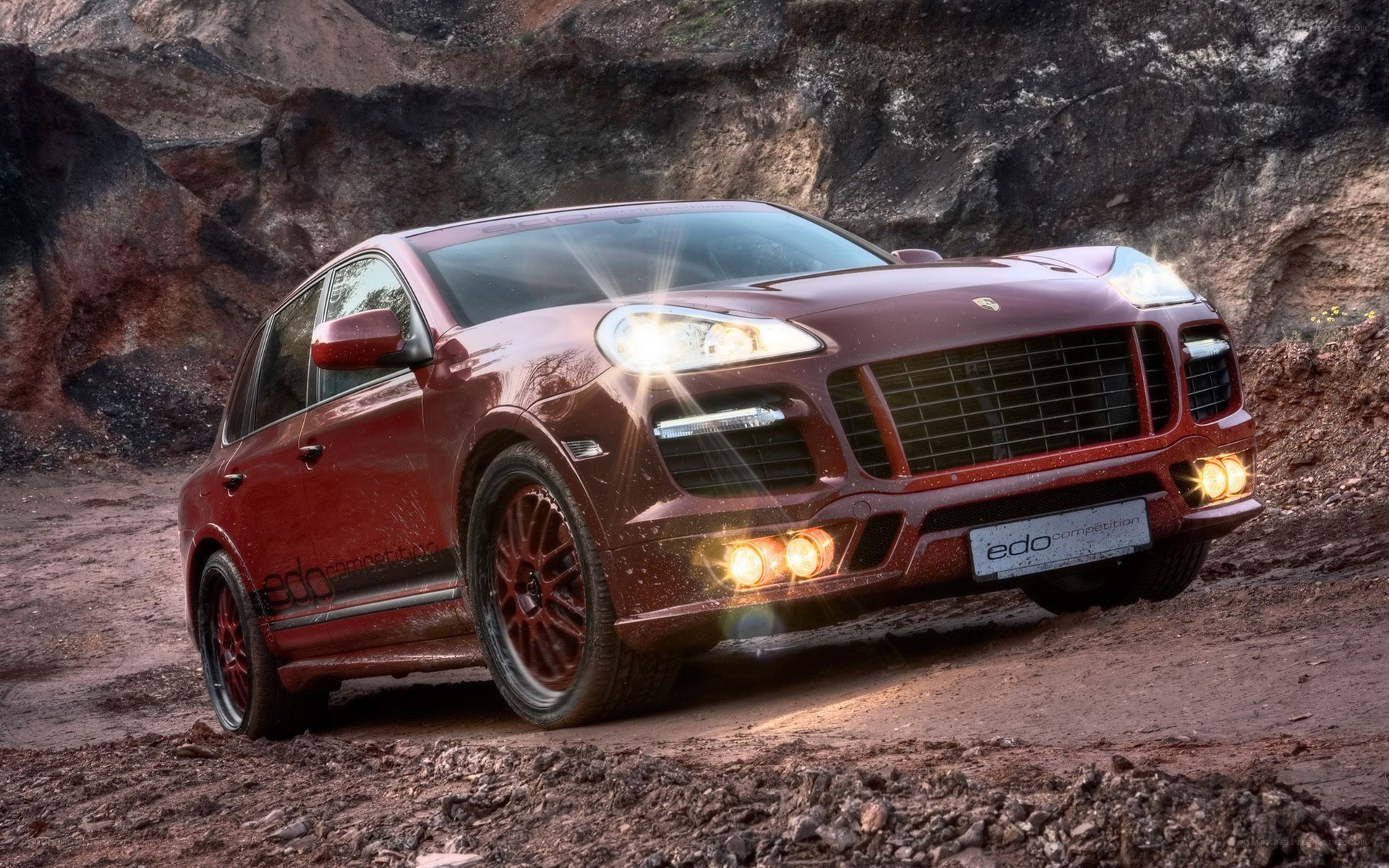 Red Porsche Cayenne off-road