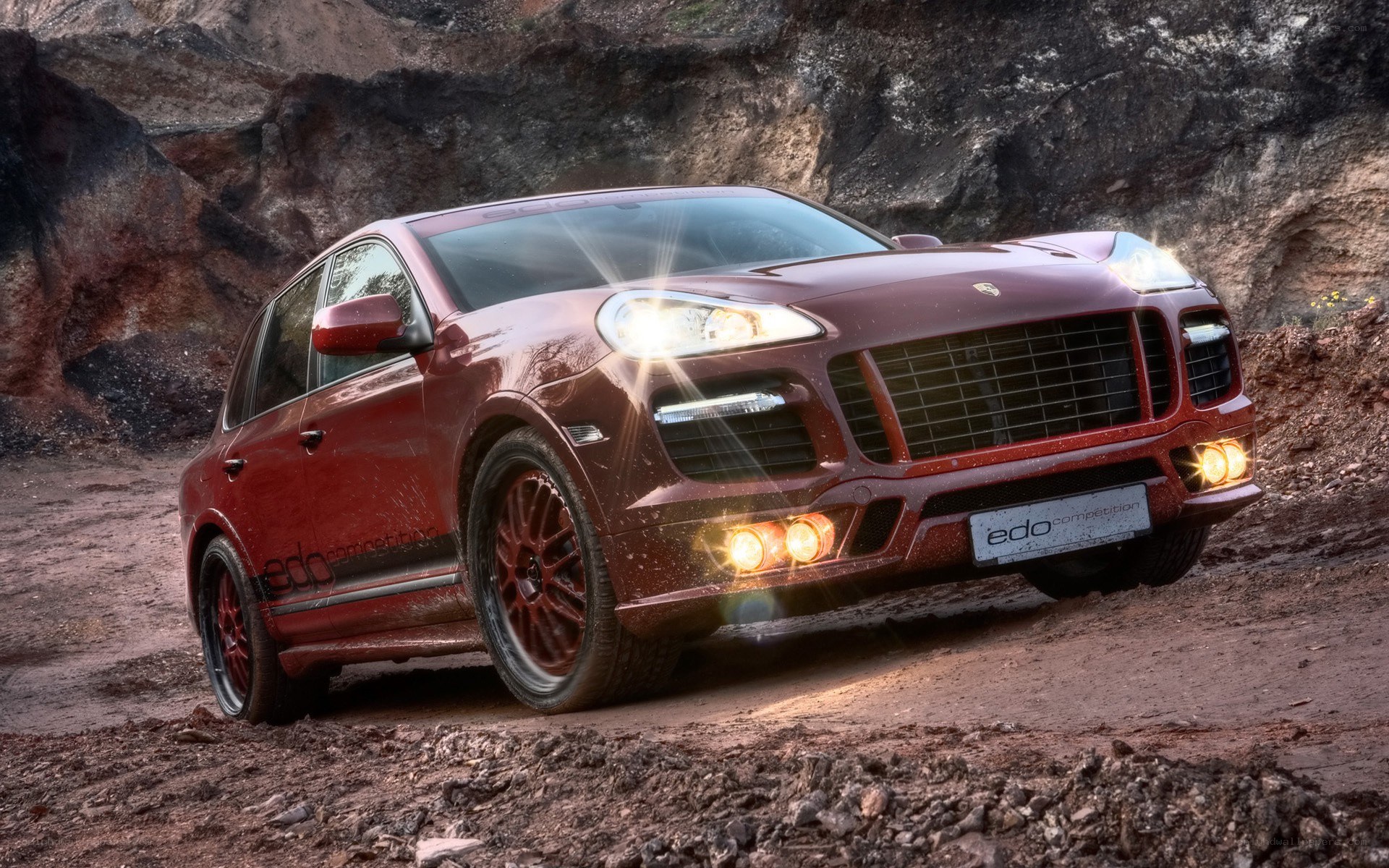 Red Porsche Cayenne off-road