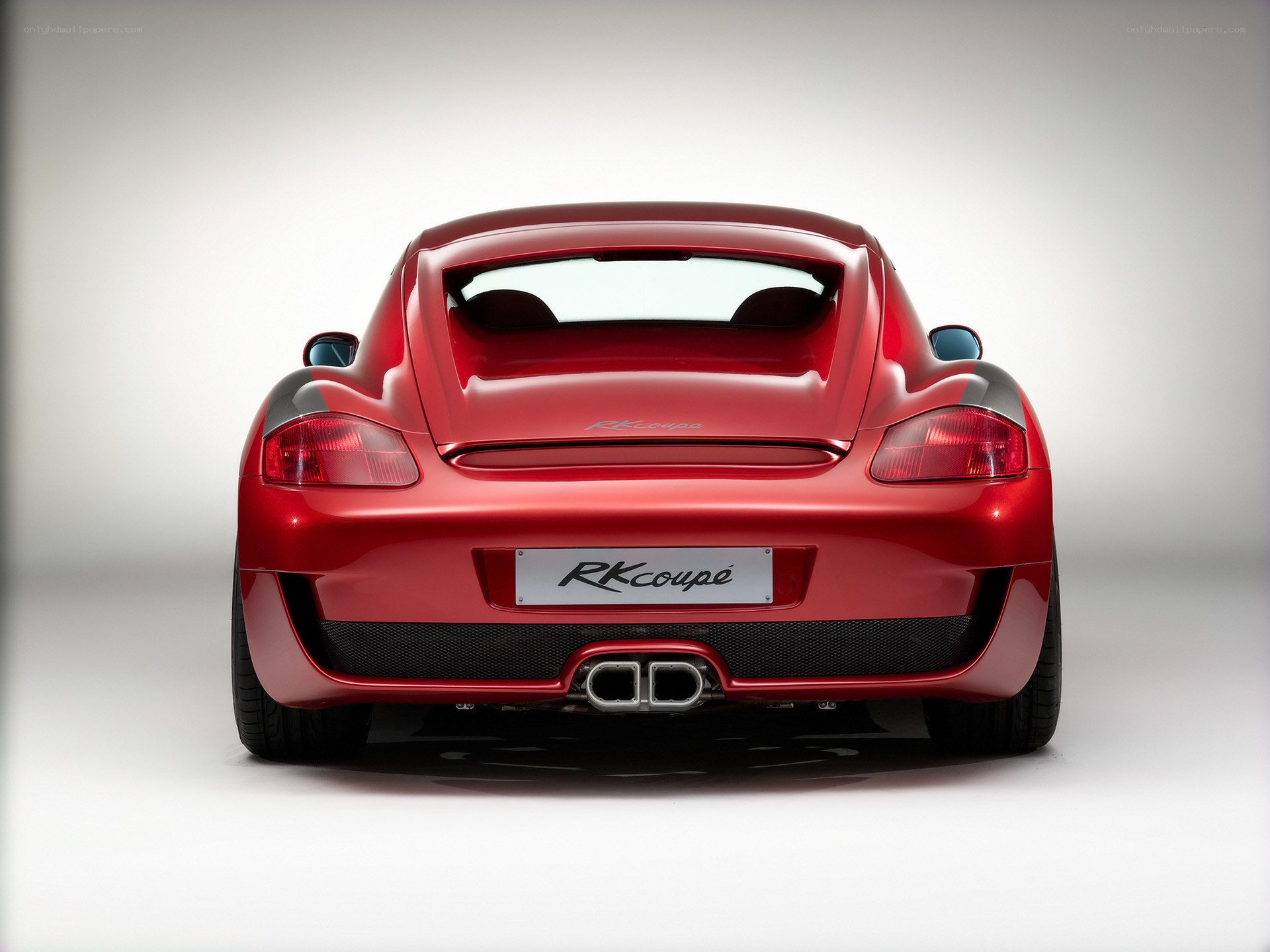 Red Porsche Cayman rear view