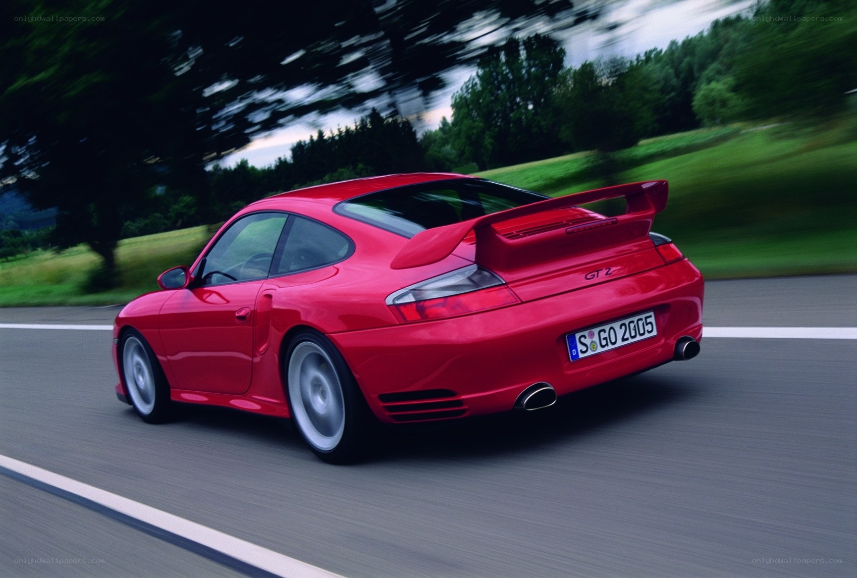 Red Porsche GT2 in motion