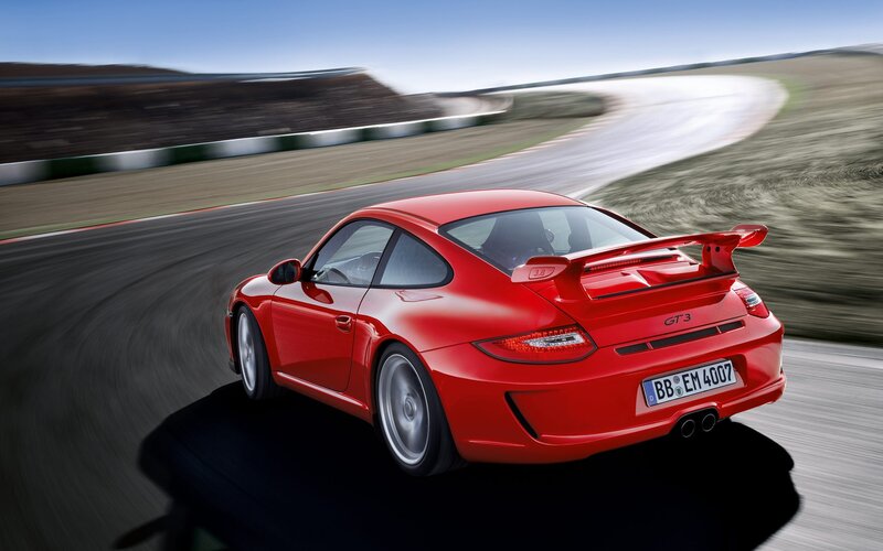 Red Porsche GT3 on a racetrack