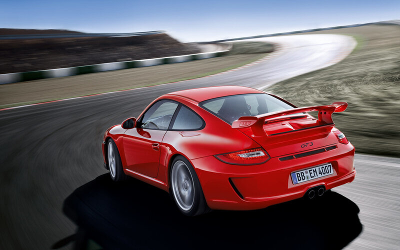 Red Porsche GT3 on racetrack