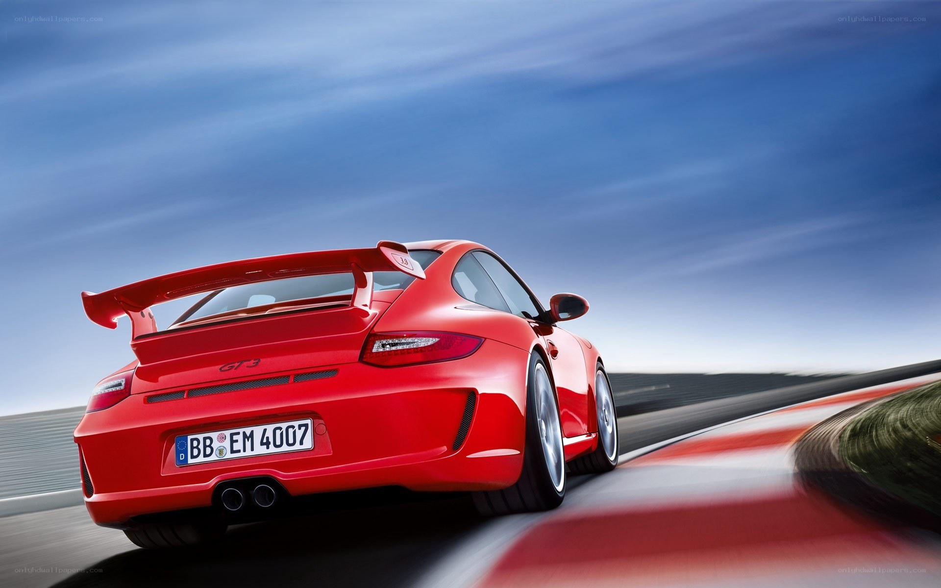 Red Porsche GT3 on racetrack