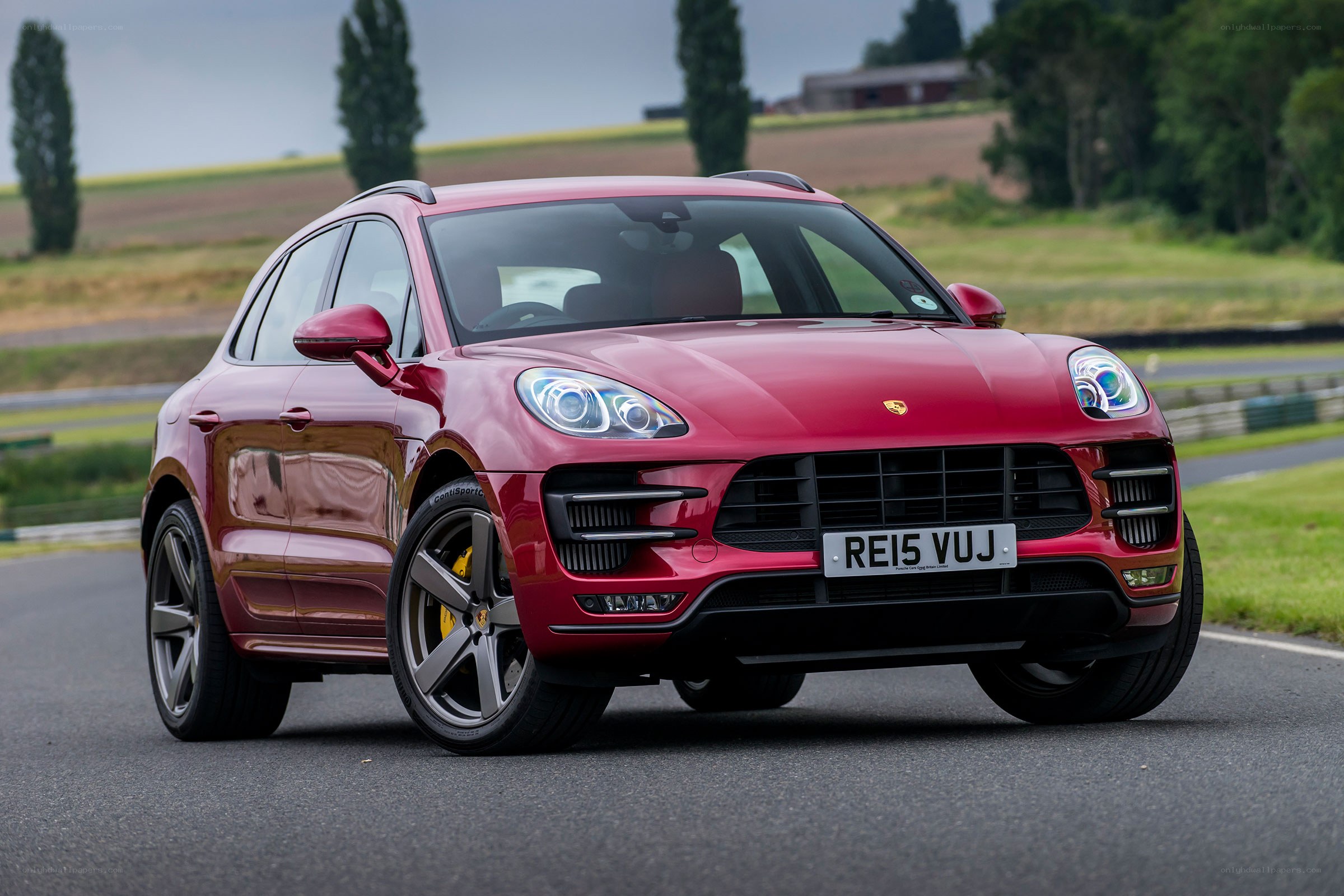 Red Porsche Macan on a track